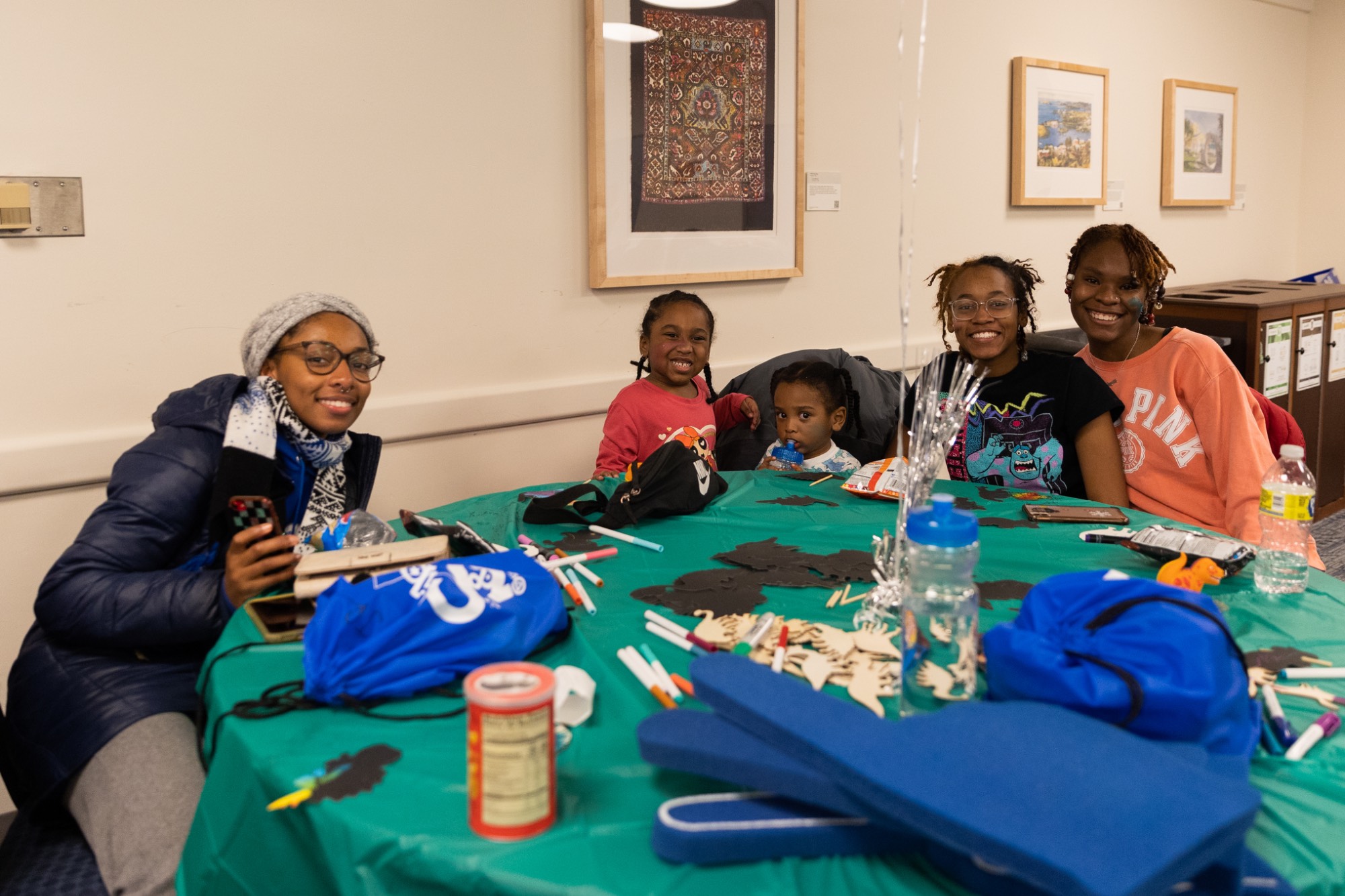 smiling kids at table during sibs and kids weekend